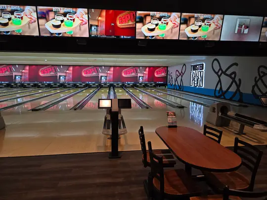 Traditional bowling lanes and tables at Twisted Pin